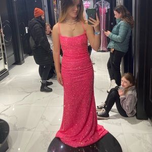 Bright Pink sparkly body con prom dress with long train and tie in the back